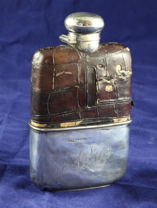 An Edwardian silver and crocodile skin mounted glass hip flask, 5.25in.